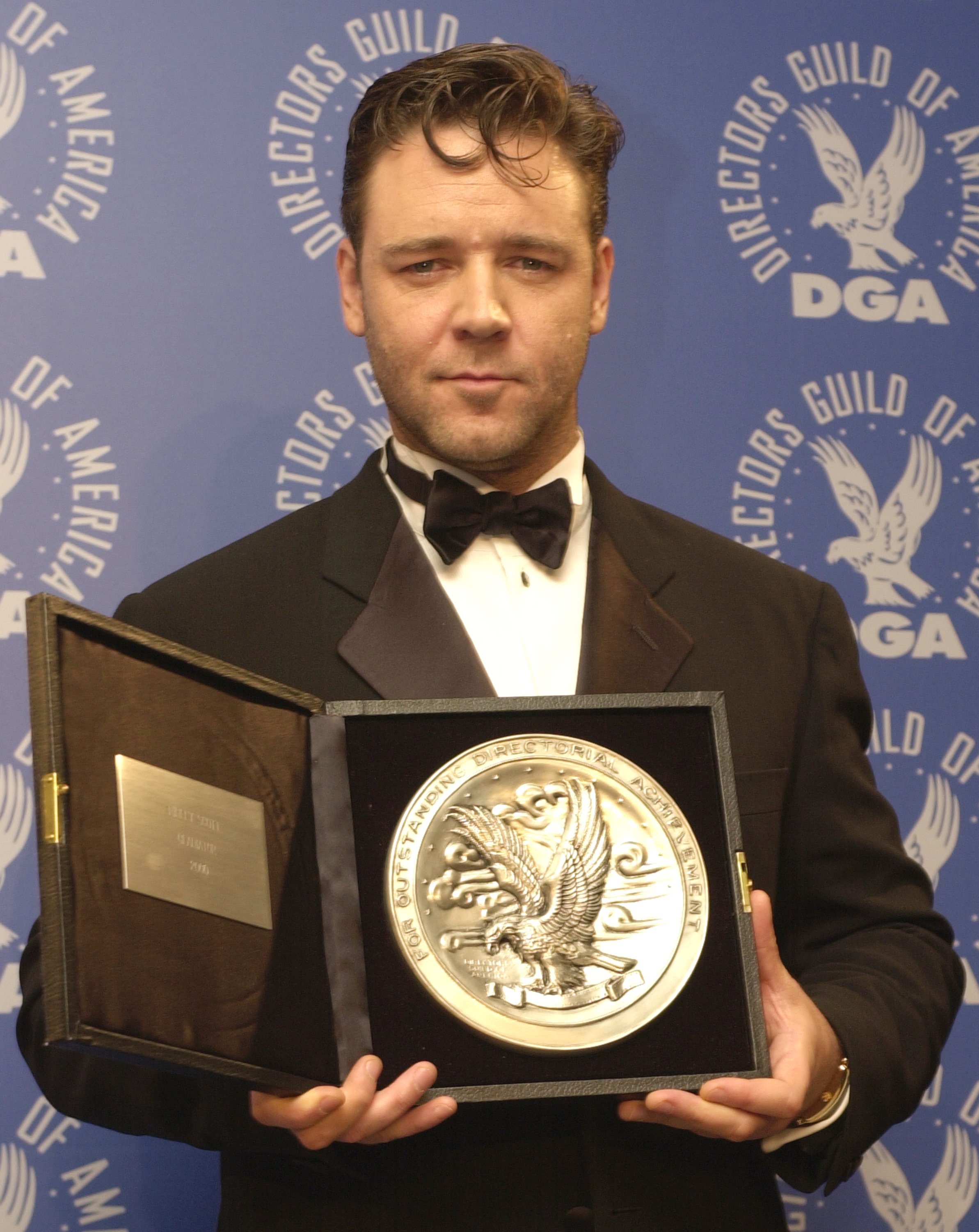 Actor Russell Crowe, accepting the nominee's plate for Outstanding Directorial Achievement in Feature Film on behalf of director Ridley Scott and his film 'Gladiator', poses for photographers at the 53rd Annual Directors Guild of America Awards March 10, 2001, at the Century Plaza Hotel in Century City, CA. (Getty Images)