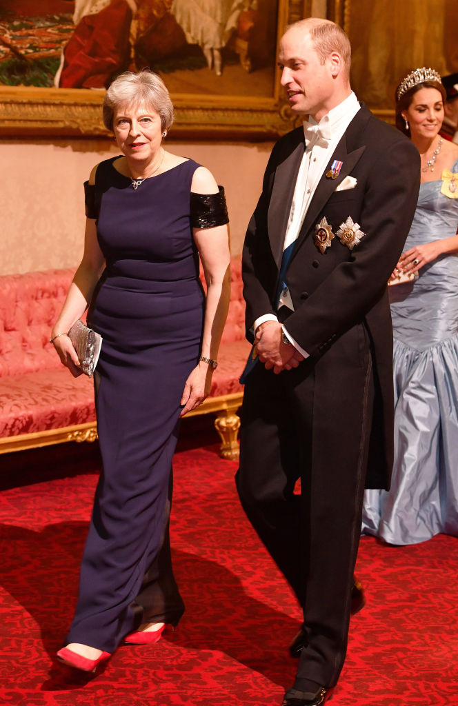 British Prime Minister Theresa May walks with Prince William, Duke of Cambridge during a State Banquet at Buckingham Palace on October 23, 2018, in London, United Kingdom. King Willem-Alexander of the Netherlands accompanied by Queen Maxima are staying at Buckingham Palace during their two-day stay in the UK. The last State Visit from the Netherlands was by Queen Beatrix and Prince Claus in 1982. (Getty Images)