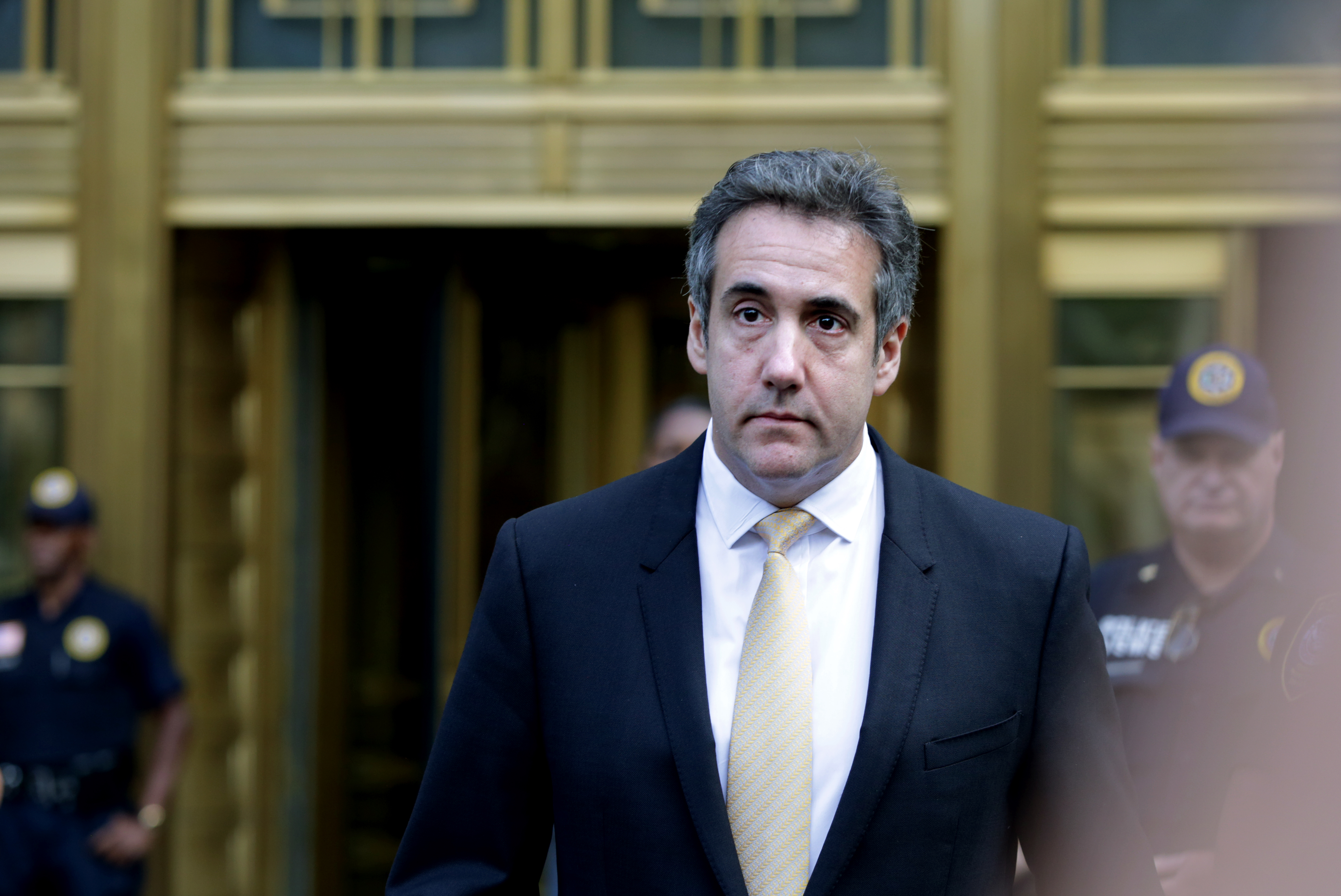Michael Cohen, former lawyer to U.S. President Donald Trump, exits the Federal Courthouse on August 21, 2018 in New York City. Cohen reached an agreement with prosecutors, pleading guilty to charges involving bank fraud, tax fraud and campaign finance violations.