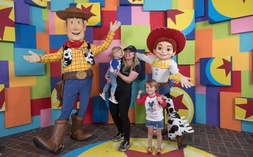 In this handout photo provided by Disneyland Resort, singer Kelly Clarkson and her children, Remington Alexander and River Rose, visit with Pixar pals Woody and Jessie at the launch of Pixar Fest at the Disneyland Resort in Anaheim, Calif., on Thursday. The first-ever Pixar Fest, the biggest Pixar celebration ever to come to Disney Parks, continues through Sept. 3, 2018.