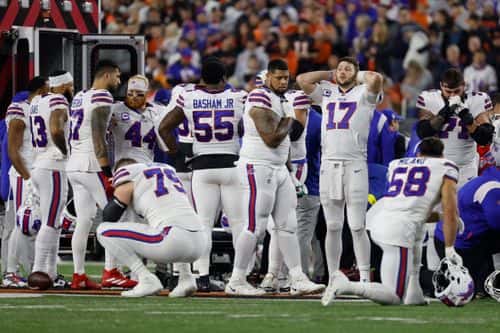 Buffalo Bills players react after teammate Damar Hamlin #3 was injured against the Cincinnati Bengals during the first quarter at Paycor Stadium on January 02, 2023 in Cincinnati, Ohio.
