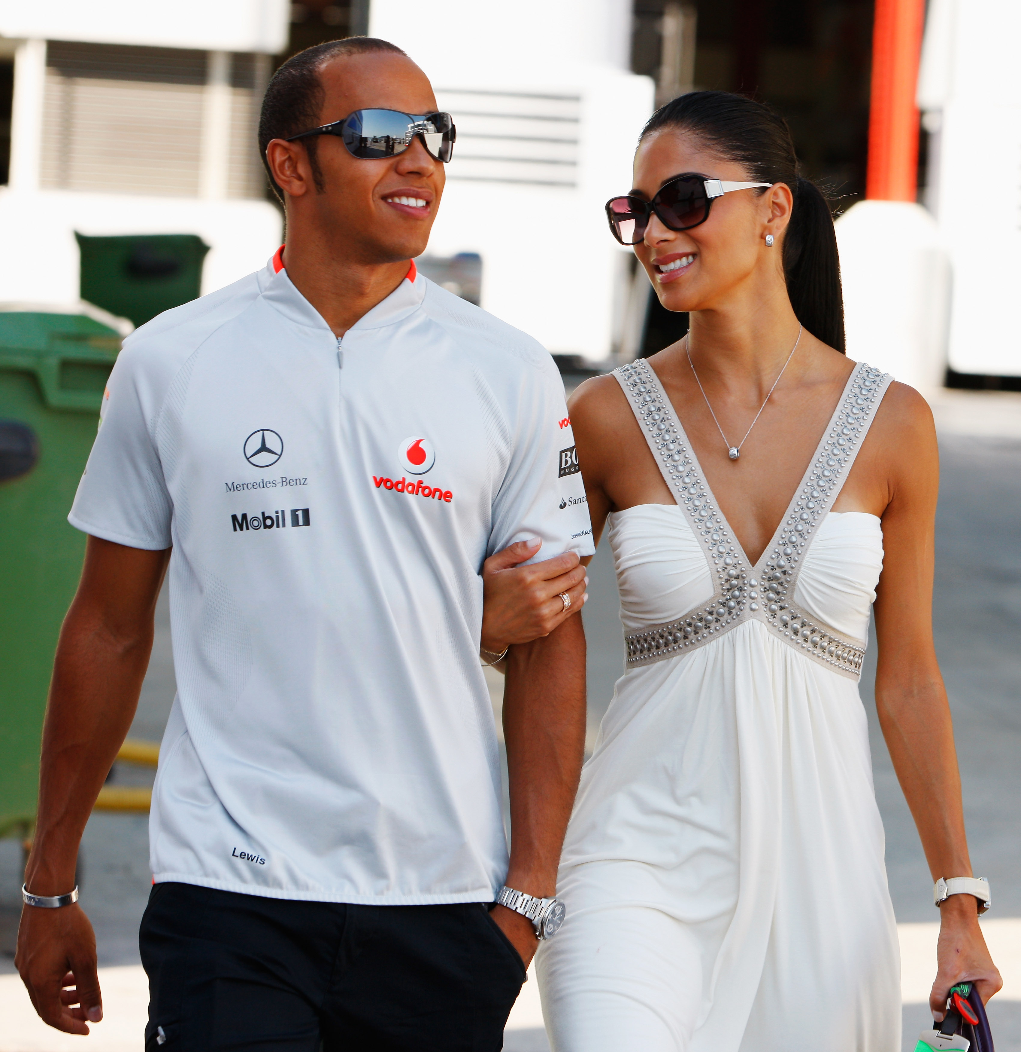 Lewis Hamilton of Great Britain and McLaren Mercedes and his girlfriend Nicole Scherzinger of the Pussycat Dolls walk in the paddock before the European Formula One Grand Prix at the Valencia Street Circuit on August 23, 2009, in Valencia, Spain. (Photo by Mark Thompson/Getty Images)