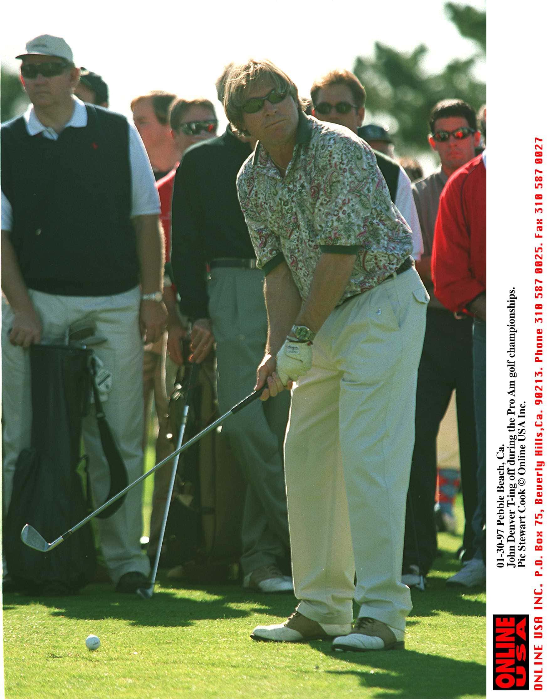 01-30-97 Pebble Beach, Ca. John Denver T-ing off at the pro am golf championships.