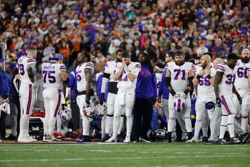 Buffalo Bills players react after teammate Damar Hamlin #3 was injured against the Cincinnati Bengals during the first quarter at Paycor Stadium on January 02, 2023 in Cincinnati, Ohio.