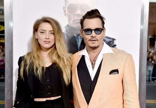 Actors Amber Heard (L) and Johnny Depp attend the 