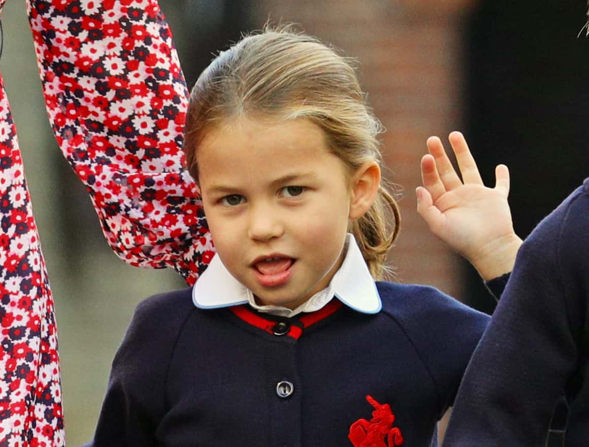 Princess Charlotte waves as she arrives for her first day of school at Thomas's Battersea in London, accompanied by her brother Prince George and her parents the Duke and Duchess of Cambridge on September 5, 2019 in London, England.