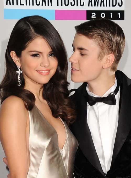 Actress Selena Gomez and musician Justin Bieber arrive at the 2011 American Music Awards held at Nokia Theatre L.A. LIVE on November 20, 2011 in Los Angeles, California.
