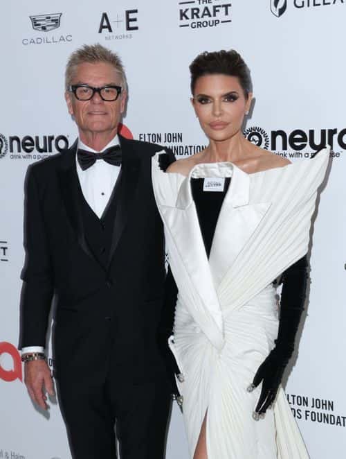 Harry Hamlin and Lisa Rinna attend Elton John AIDS Foundation's 31st annual academy awards viewing party on March 12, 2023 in West Hollywood, California.