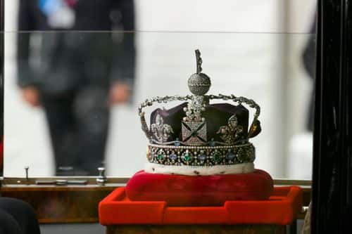 A car carrying the crown arrives for the State Opening of Parliament in the House of Lords at the Palace of Westminster on May 10, 2022 in London, England. The State Opening of Parliament formally marks the beginning of the new session of Parliament. It includes Queen's Speech, prepared for her to read from the throne, by her government outlining its plans for new laws being brought forward in the coming parliamentary year. This year the speech will be read by the Prince of Wales as HM The Queen will miss the event due to ongoing mobility issues.