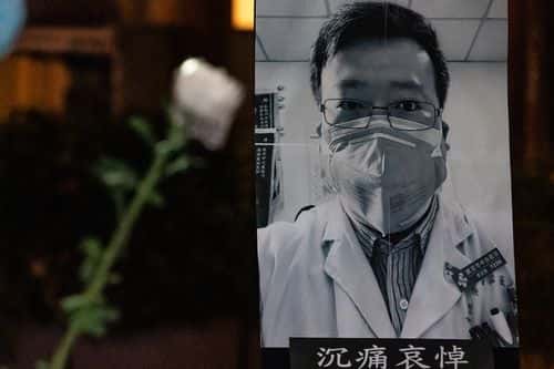 People attend a vigil to mourn for doctor Li Wenliang on February 7, 2020 in Hong Kong, China. Doctor Li Wenliang was a Chinese ophthalmologist at Wuhan Central Hospital and a whistleblower who warned about the novel coronavirus outbreak but was summoned by police and admonished him for making false comments on the Internet.