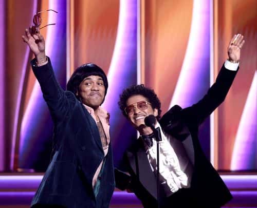 (L-R) Anderson .Paak and Bruno Mars of Silk Sonic accept Record Of The Year award for ‘Leave The Door Open’ onstage during the 64th Annual GRAMMY Awards at MGM Grand Garden Arena on April 03, 2022 in Las Vegas, Nevada.
