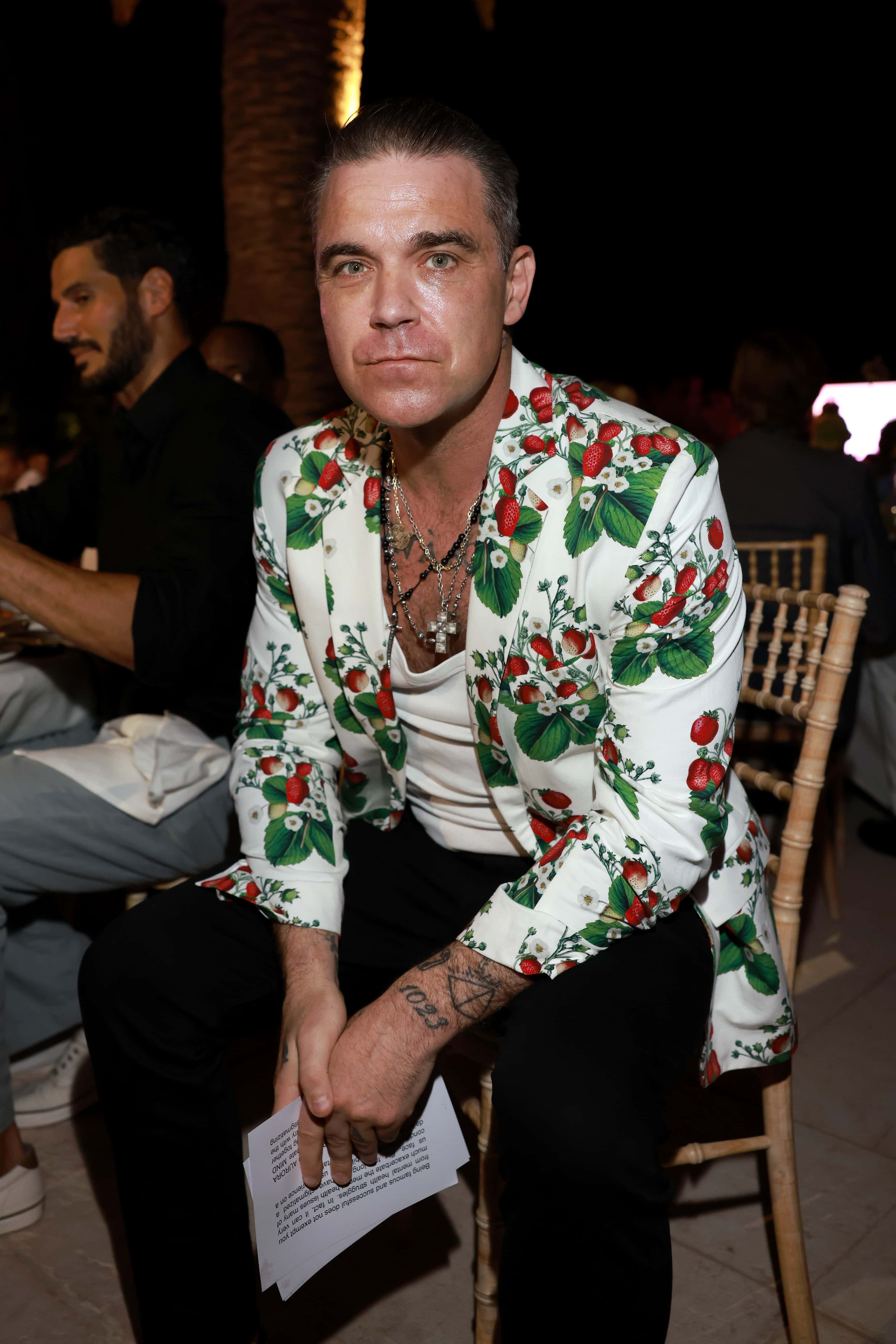 Robbie Williams attends the AURORA INSTITUTE Special Evening hosted by Christian Angermayer, Louise Tabbiner, Henry and Souraya Chalhoub at Le Beauvallon on July 23, 2022 in Saint-Tropez, France.