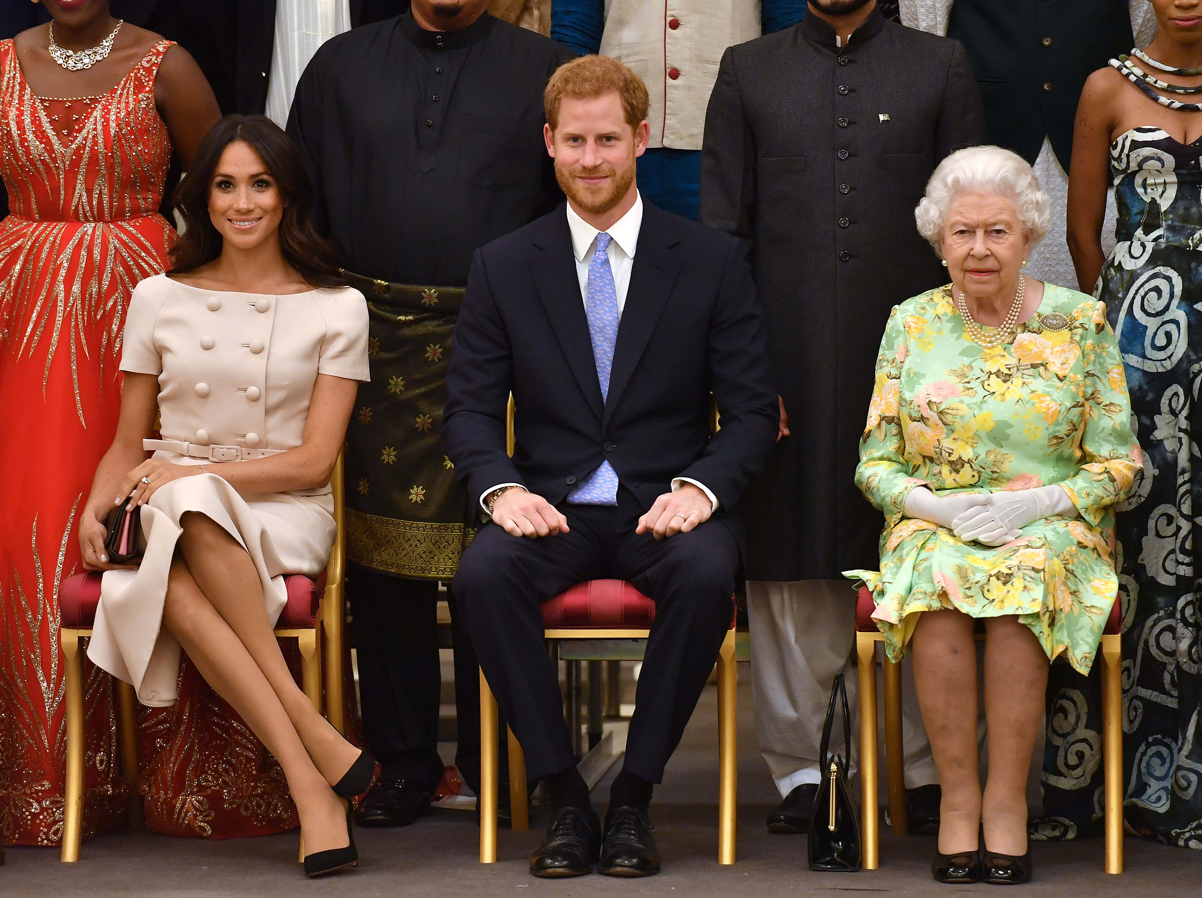 Meghan, Duchess of Sussex, Prince Harry, Duke of Sussex and Queen Elizabeth II at the Queen's Young Leaders Awards Ceremony at Buckingham Palace on June 26, 2018 in London, England. The Queen's Young Leaders Programme, now in its fourth and final year, celebrates the achievements of young people from across the Commonwealth working to improve the lives of people across a diverse range of issues including supporting people living with mental health problems, access to education, promoting gender equality, food scarcity and climate change.
