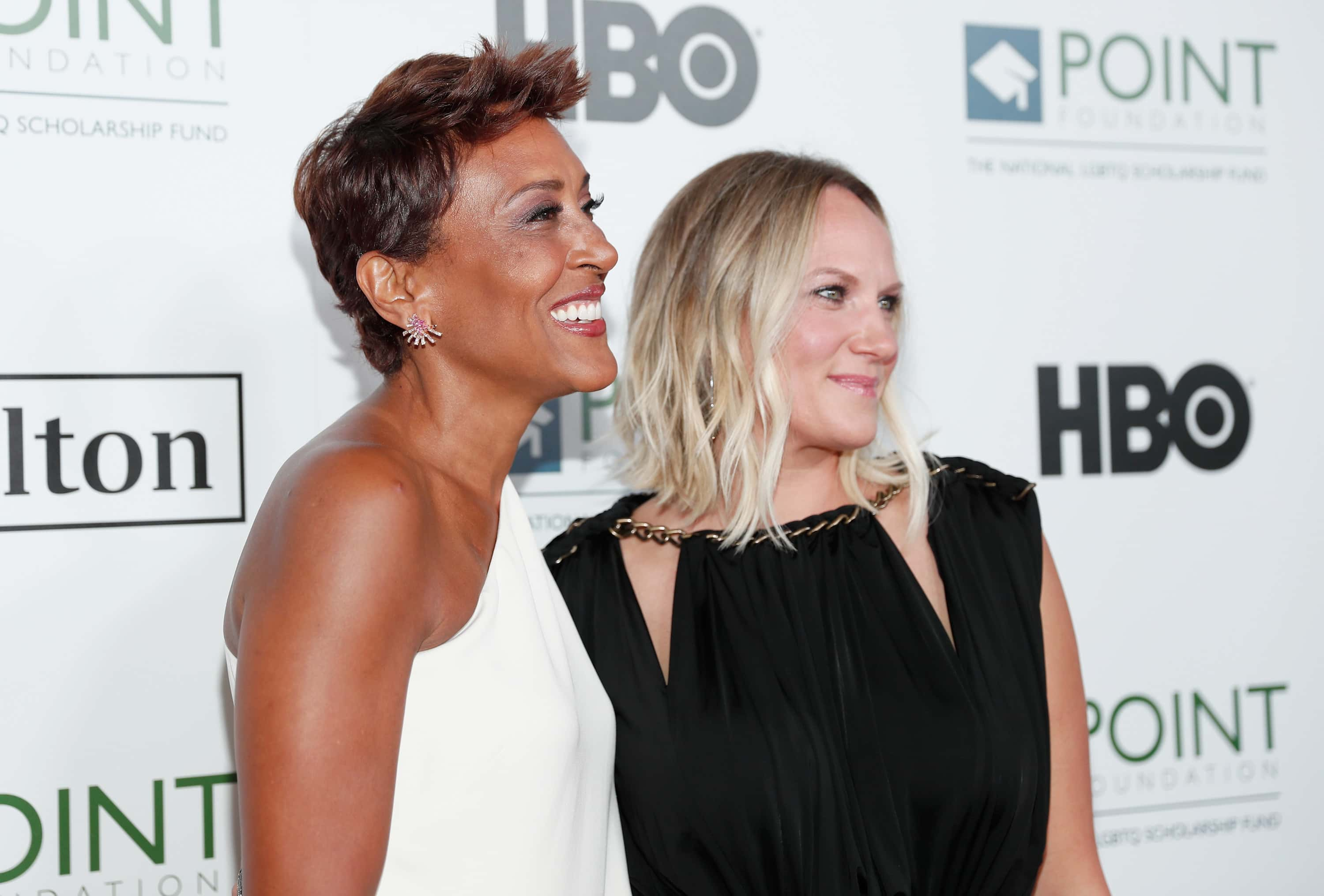 Television personality Robin Roberts and Amber Laign arrive at Point Foundation's Point Honors gala at The Beverly Hilton Hotel on October 1, 2016 in Beverly Hills, California.