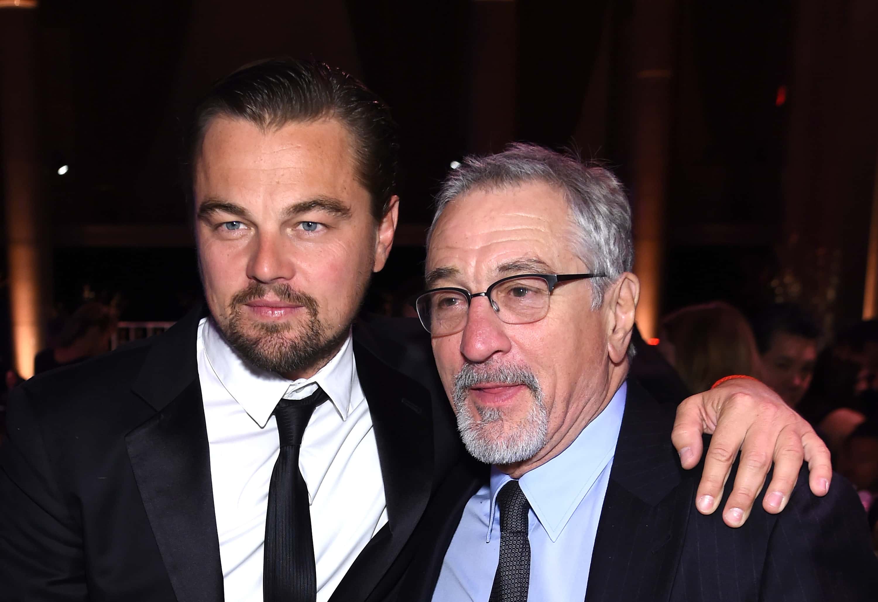Leonardo DiCaprio (L) and Robert De Niro attend the 2016 amfAR New York Gala at Cipriani Wall Street on February 10, 2016 in New York City.