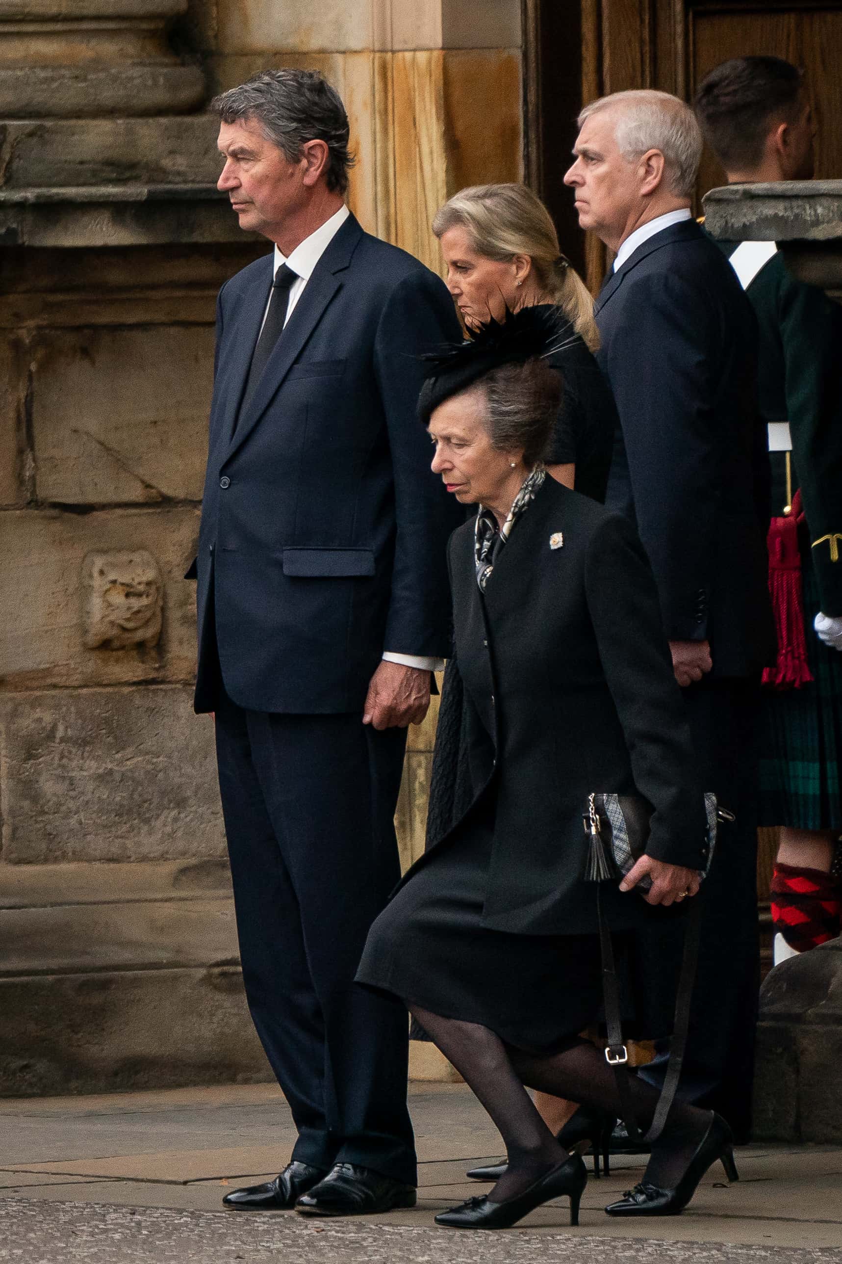 Vice Admiral Timothy Laurence, Britain's Sophie, Countess of Wessex and Britain's Prince Andrew, Duke of York look on as Britain's Princess Anne, Princess Royal curtseys the coffin of Queen Elizabeth II, as it arrives at Holyroodhouse on September 11, 2022 in Edinburgh, United Kingdom. Elizabeth Alexandra Mary Windsor was born in Bruton Street, Mayfair, London on 21 April 1926. She married Prince Philip in 1947 and ascended the throne of the United Kingdom and Commonwealth on 6 February 1952 after the death of her Father, King George VI. Queen Elizabeth II died at Balmoral Castle in Scotland on September 8, 2022, and is succeeded by her eldest son, King Charles III.