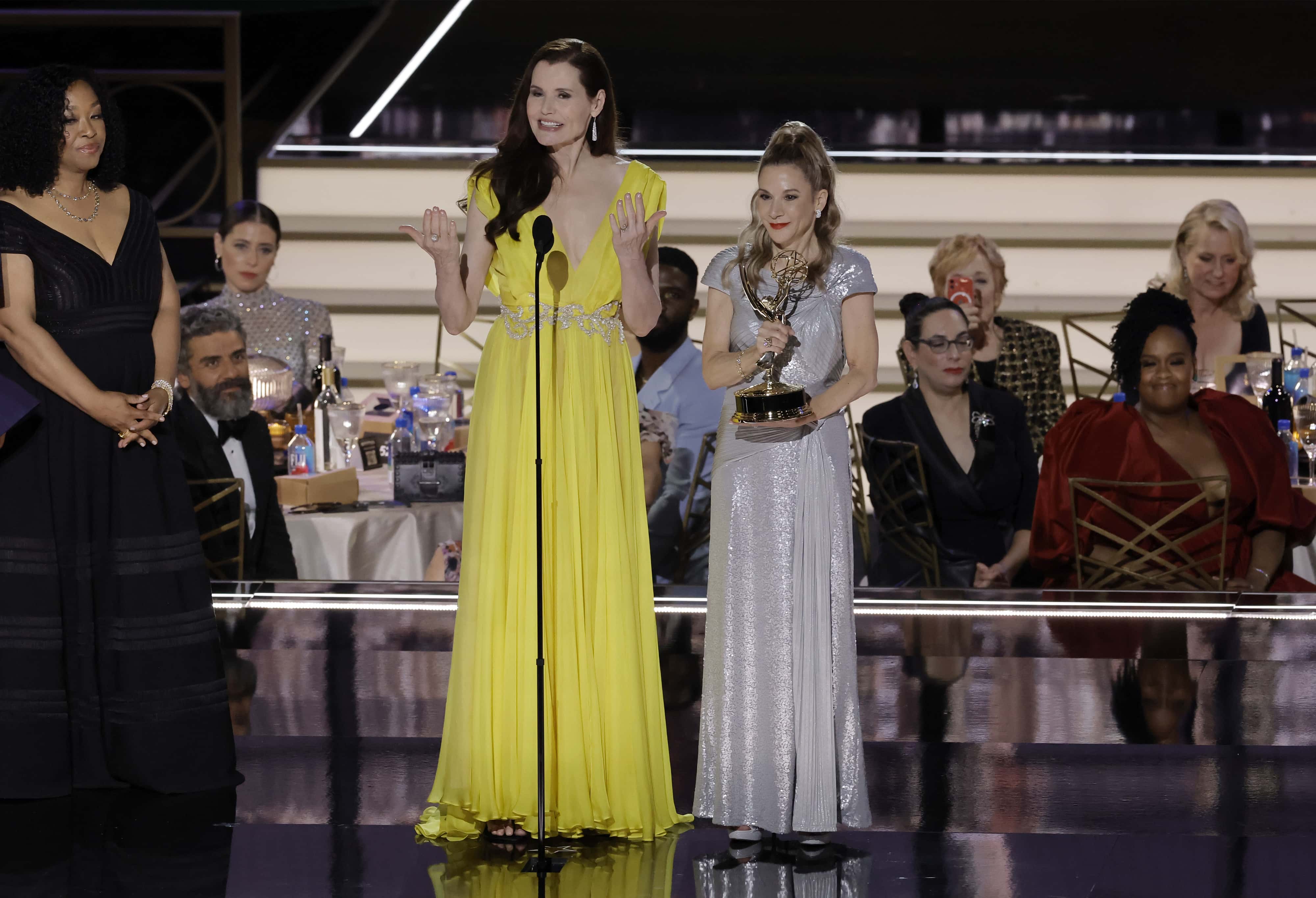 (L-R) Geena Davis and Madeline Di Nonno accept the Governors Award for the Geena Davis Institute on Gender in Media from Shonda Rhimes (L) onstage during the 74th Primetime Emmys at Microsoft Theater on September 12, 2022 in Los Angeles, California.