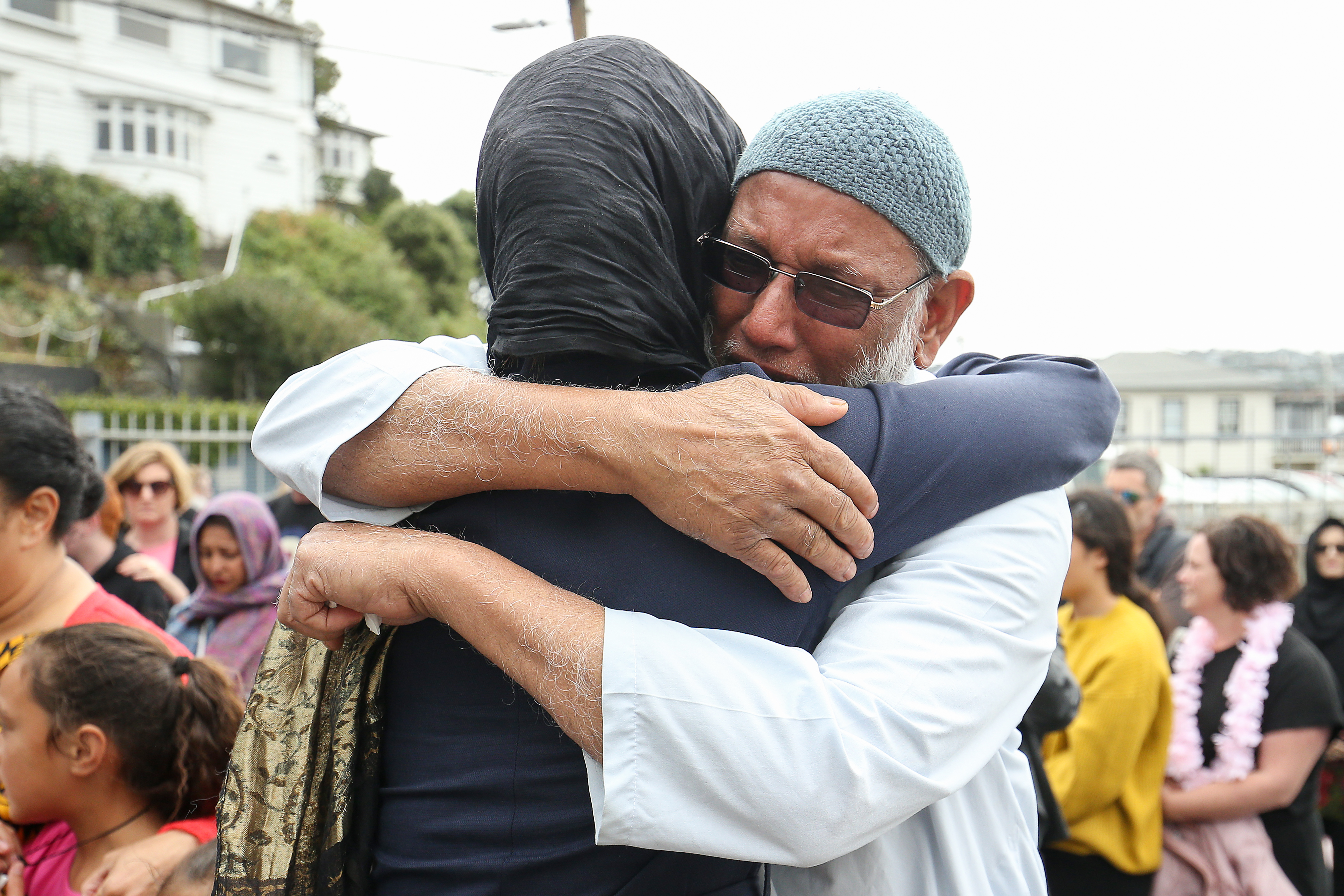 Prime Minister Jacinda Ardern hugs a mosque-goer at the Kilbirnie Mosque on March 17, 2019, in Wellington, New Zealand. 50 people are confirmed dead and 36 are injured still in hospital following shooting attacks on two mosques in Christchurch on Friday, 15 March. The attack is the worst mass shooting in New Zealand's history. (Source: Hagen Hopkins/Getty Images)