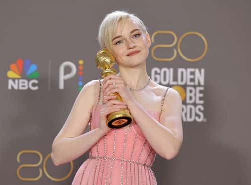 Julia Garner poses with the Best Supporting Actress in a Television Series – Musical-Comedy or Drama award for