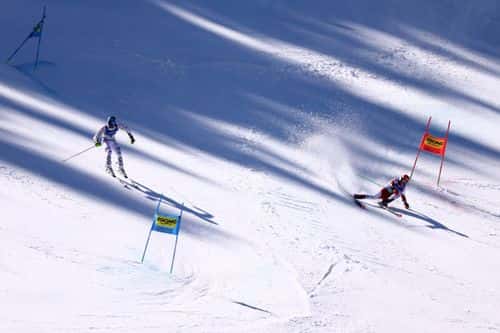 Alexander Schmid of Germany (L) and Dominik Raschner of Austria compete in the big final of Men's Parallel Slalom at the FIS Alpine World Ski Championships on February 15, 2023 in Meribel, France.