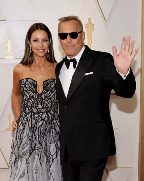 (L-R) Christine Baumgartner and Kevin Costner attend the 94th Annual Academy Awards at Hollywood and Highland on March 27, 2022 in Hollywood, California.