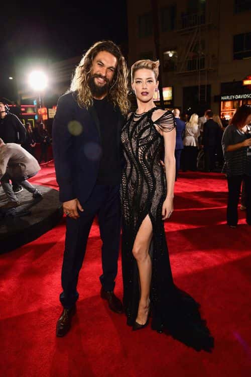 Actors Jason Momoa and Amber Heard attend the premiere of Warner Bros. Pictures'