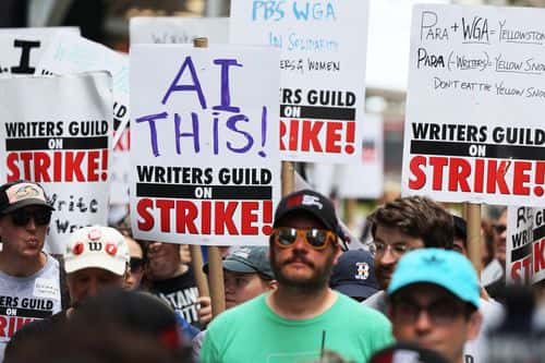 Members of the Writers Guild of America East are joined by SAG-AFTRA members as they picket on Day 1 at the Warner Bros. Discovery NYC office on July 13, 2023 in New York City. SAG-AFTRA members joined a picketline with WGA members for a Support Staff Solidarity Day, a day after their contract expired and with membership previously authorizing a strike, with nearly 98 percent of voters in favor. WGA have been on strike since May 2.
