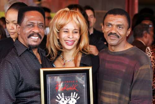 Musician Ike Turner (L) stands with guest Audrey Madison and Ike Turner Jr. after he was inducted into the Hollywood Rockwalk along with Muddy Waters, Robert Cray, Solomon Burke and Etta James on April 4, 2005 in Hollywood, California.