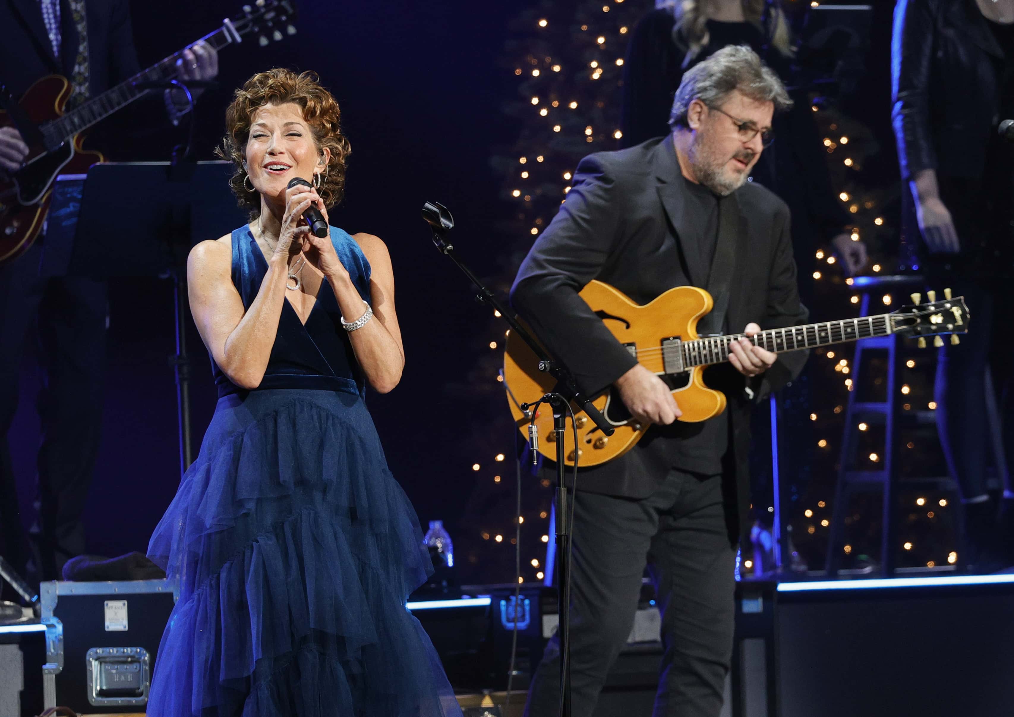 Amy Grant and Vince Gill perform at the Ryman Auditorium on December 13, 2021 in Nashville, Tennessee.