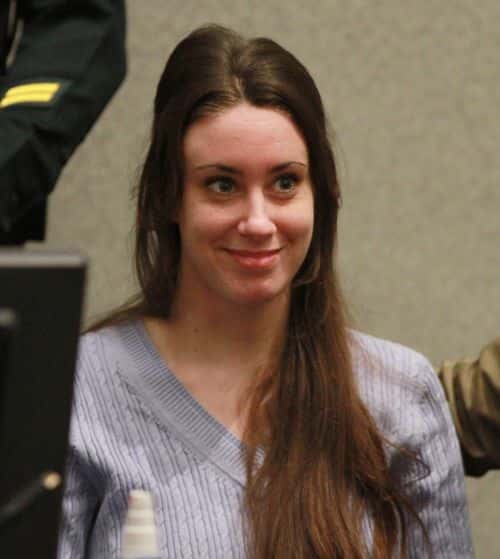 Casey Anthony smiles before the start of her sentencing hearing on charges of lying to a law enforcement officer at the Orange County Courthouse July 7, 2011 in Orlando, Florida.  Anthony was acquitted of murder charges on July 5, 2011 but will serve four, one-year sentences on her conviction of lying to a law enforcement officer. She will be credited for the nearly three-years of time served and good behavior and will be released July 13.