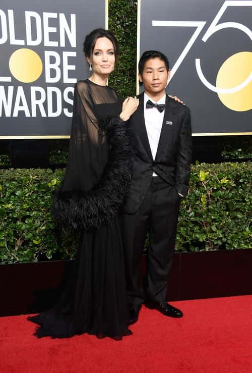 Actor/director Angelina Jolie (L) and Pax Thien Jolie-Pitt attend The 75th Annual Golden Globe Awards at The Beverly Hilton Hotel on January 7, 2018 in Beverly Hills, California.