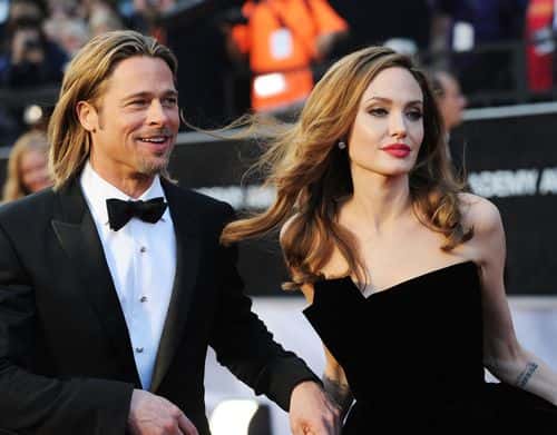 Actor Brad Pitt (L) and actress Angelina Jolie arrive at the 84th Annual Academy Awards held at the Hollywood & Highland Center on February 26, 2012 in Hollywood, California.
