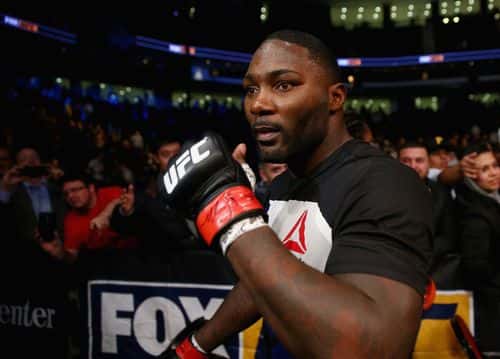 Anthony Johnson of the United States	 leaves the Octagon after his win by TKO against Ryan Bader of the United States in the first round of their light heavyweight bout during the UFC Fight Night event at the Prudential Center on January 30, 2016 in Newark, New Jersey.