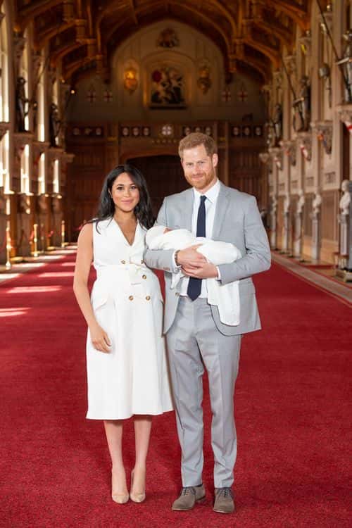 Prince Harry, Duke of Sussex and Meghan, Duchess of Sussex, pose with their newborn son Archie Harrison Mountbatten-Windsor during a photocall in St George's Hall at Windsor Castle on May 8, 2019 in Windsor, England. The Duchess of Sussex gave birth at 05:26 on Monday 06 May, 2019.