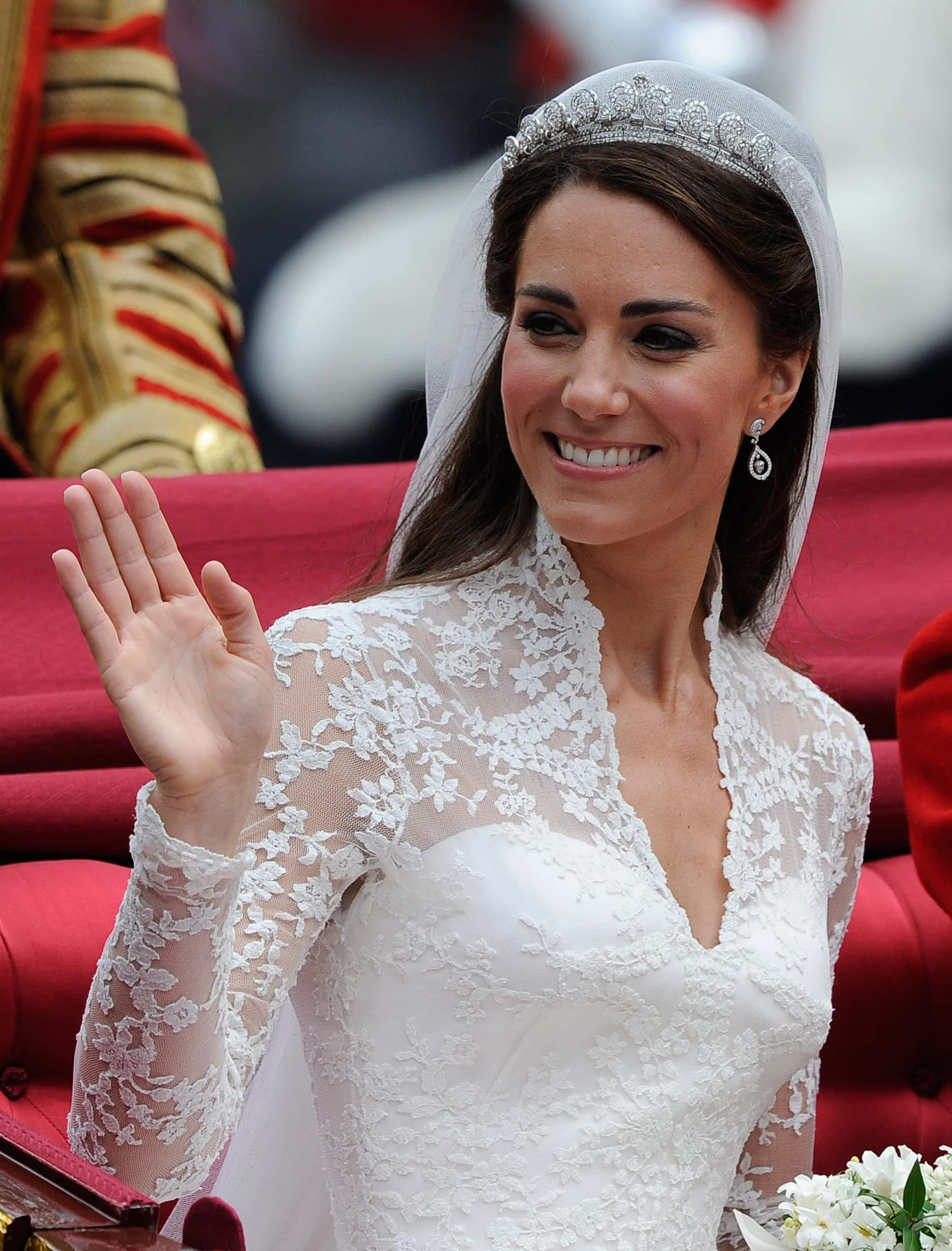 LONDON, ENGLAND - APRIL 29:  Catherine, Duchess of Cambridge waves as she travels beside husband Pri