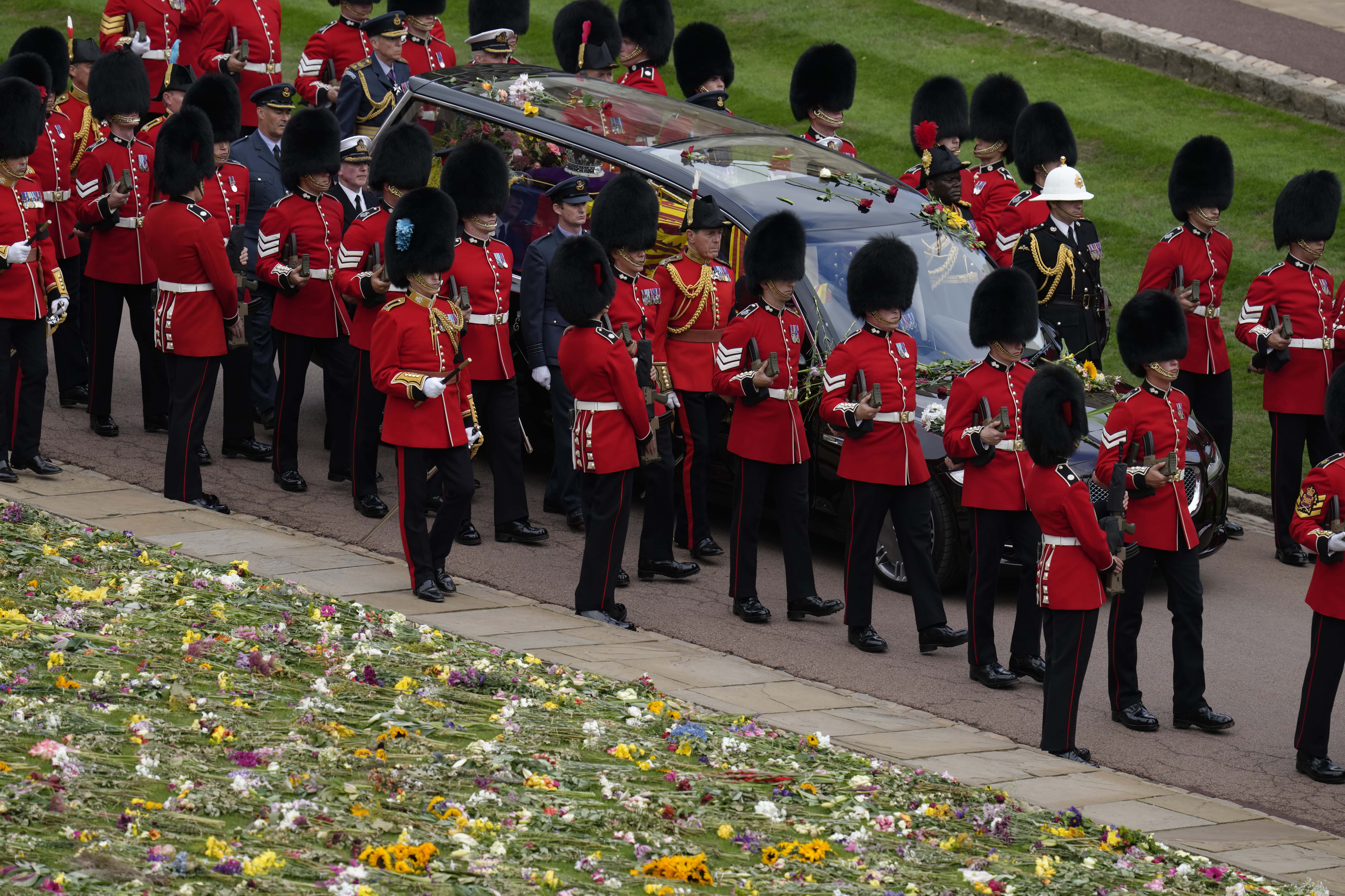 The hearse carrying the coffin of Queen Elizabeth II arrives at Windsor Castle on September 19, 2022 in Windsor, England. The committal service at St George's Chapel, Windsor Castle, took place following the state funeral at Westminster Abbey. A private burial in The King George VI Memorial Chapel followed. Queen Elizabeth II died at Balmoral Castle in Scotland on September 8, 2022, and is succeeded by her eldest son, King Charles III.
