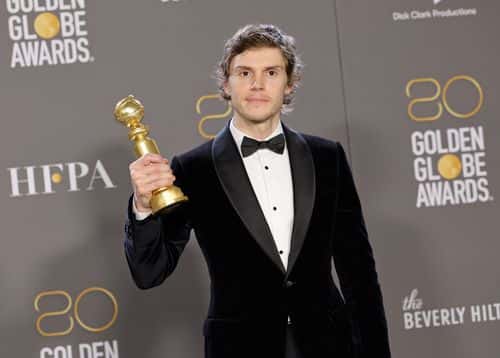 Evan Peters poses with the Best Actor in a Limited or Anthology Series or Television Film award for