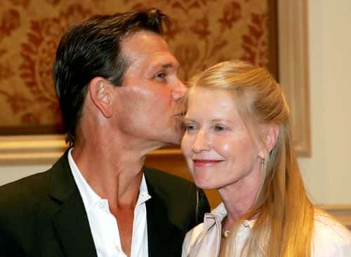Actor Patrick Swayze kisses his wife, actress Lisa Niemi, backstage after Swayze received the Independent Career Achievement Award at the Video Software Dealers Association's award show at the organization's annual home video convention at the Bellagio July 27, 2005 in Las Vegas, Nevada.