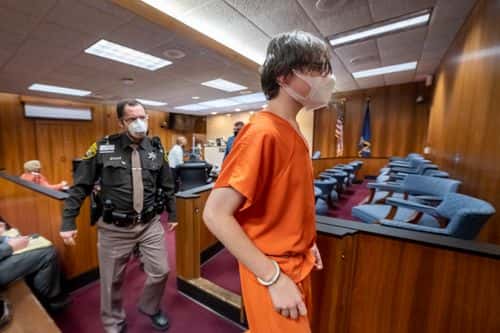 Ethan Crumbley is led away from the courtroom after a placement hearing at Oakland County Circuit Court on February 22, 2022 in Pontiac, Michigan. Crumbley, 15, is charged with the fatal shooting of four fellow students and the wounding of seven others, including a teacher at Oxford High School on November 30, 2021.