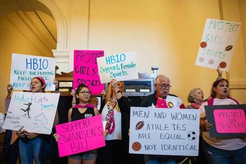 Demonstrators supporting restrictions on transgender student athletes are gathered at the Texas State Capitol on the first day of the 87th Legislature's third special session on September 20, 2021 in Austin, Texas. Following a second special session that saw the passage of controversial voting and abortion laws, Texas lawmakers have convened at the Capitol for a third special session to address more of Republican Gov. Greg Abbott's conservative priorities which include redistricting, the distribution of federal COVID-19 relief funds, vaccine mandates and restrictions on how transgender student athletes can compete in sports.
