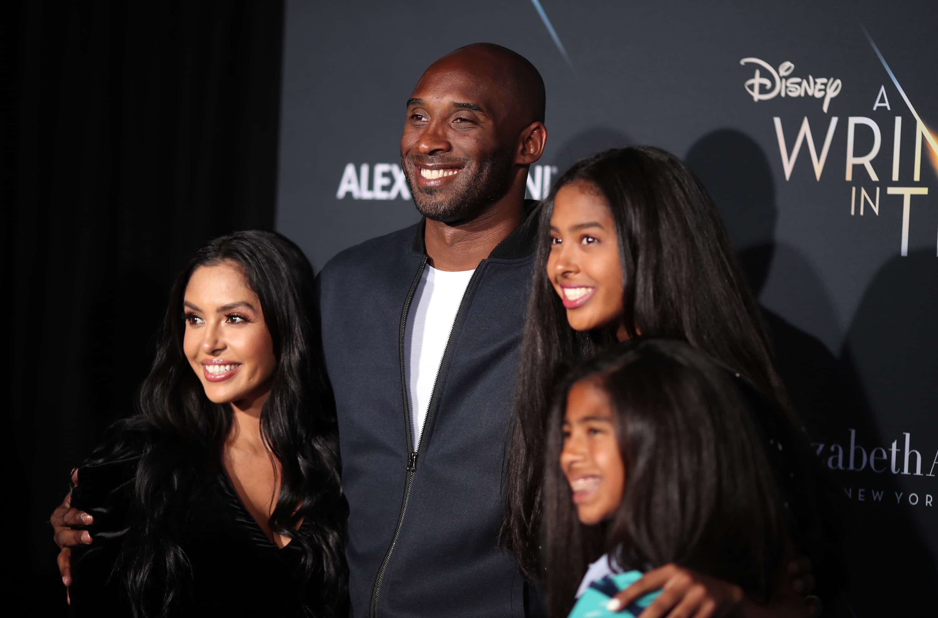 Kobe Bryant (2nd L) and his family attend the premiere of Disney's