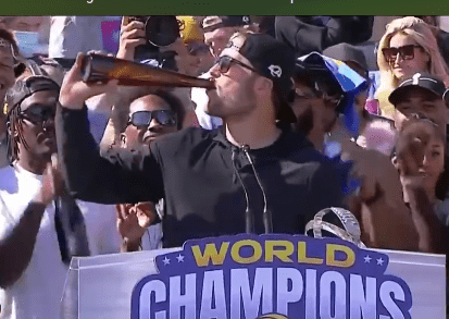 LA Rams joyous victory parade sees Super Bowl stars smoke cigars and hit  the booze as Tom Brady warns 'mix in the water'