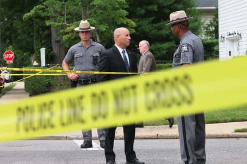 Law enforcement officials are seen as they investigate the home of a suspect arrested in the unsolved Gilgo Beach killings on July 14, 2023 in Massapequa Park, New York. A suspect in the Gilgo Beach killings was arrested in the unsolved case tied to at least 10 sets of human remains that were discovered since 2010 in suburban Long Island. The suspect Rex Heuermann is expected to be arraigned after his arrest Thursday night. A grand jury charged Heurmann with six counts of murder. The charges stem from the deaths of three of the four 