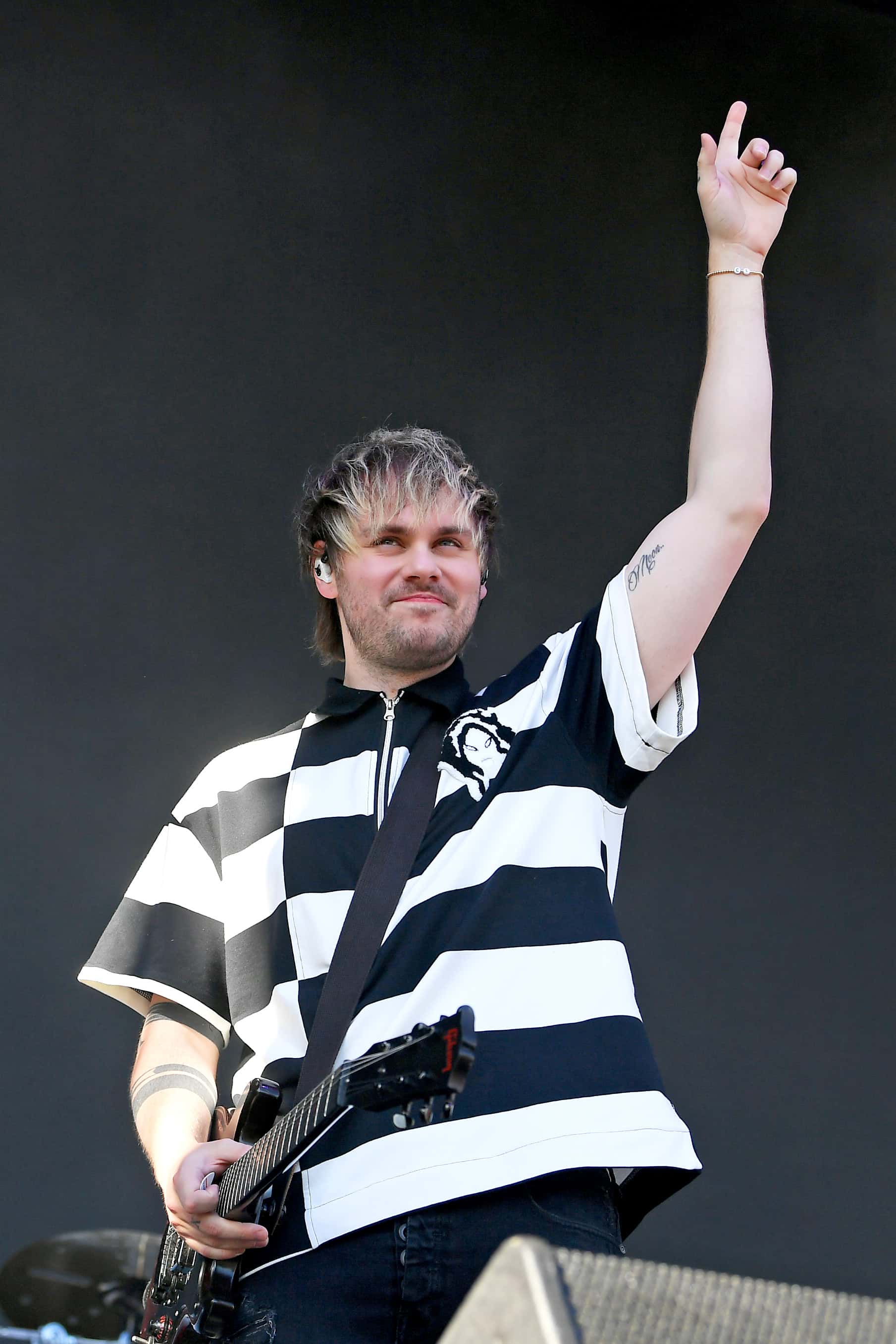 (FOR EDITORIAL USE ONLY) Michael Clifford of 5 Seconds of Summer performs onstage during the Daytime Stage at the 2022 iHeartRadio Music Festival held at AREA15 on September 24, 2022 in Las Vegas, Nevada.