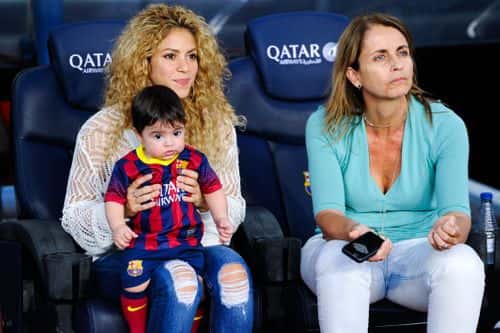 Shakira and Montserrat Bernabeu, Gerard Pique's mother, play with Milan prior to the La Liga match between FC Barcelona and Sevilla FC at Camp Nou on September 14, 2013 in Barcelona, Spain.