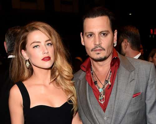 Actors Amber Heard (L) and Johnny Depp attend the 