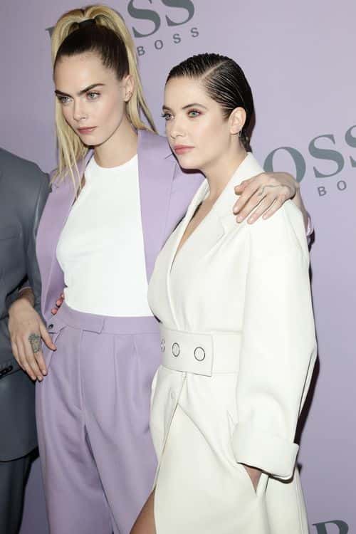 Cara Delevingne and Ashley Benson attend the BOSS fashion show during the Milan Fashion Week Fall/Winter 2020 - 2021 on February 23, 2020 in Milan, Italy.