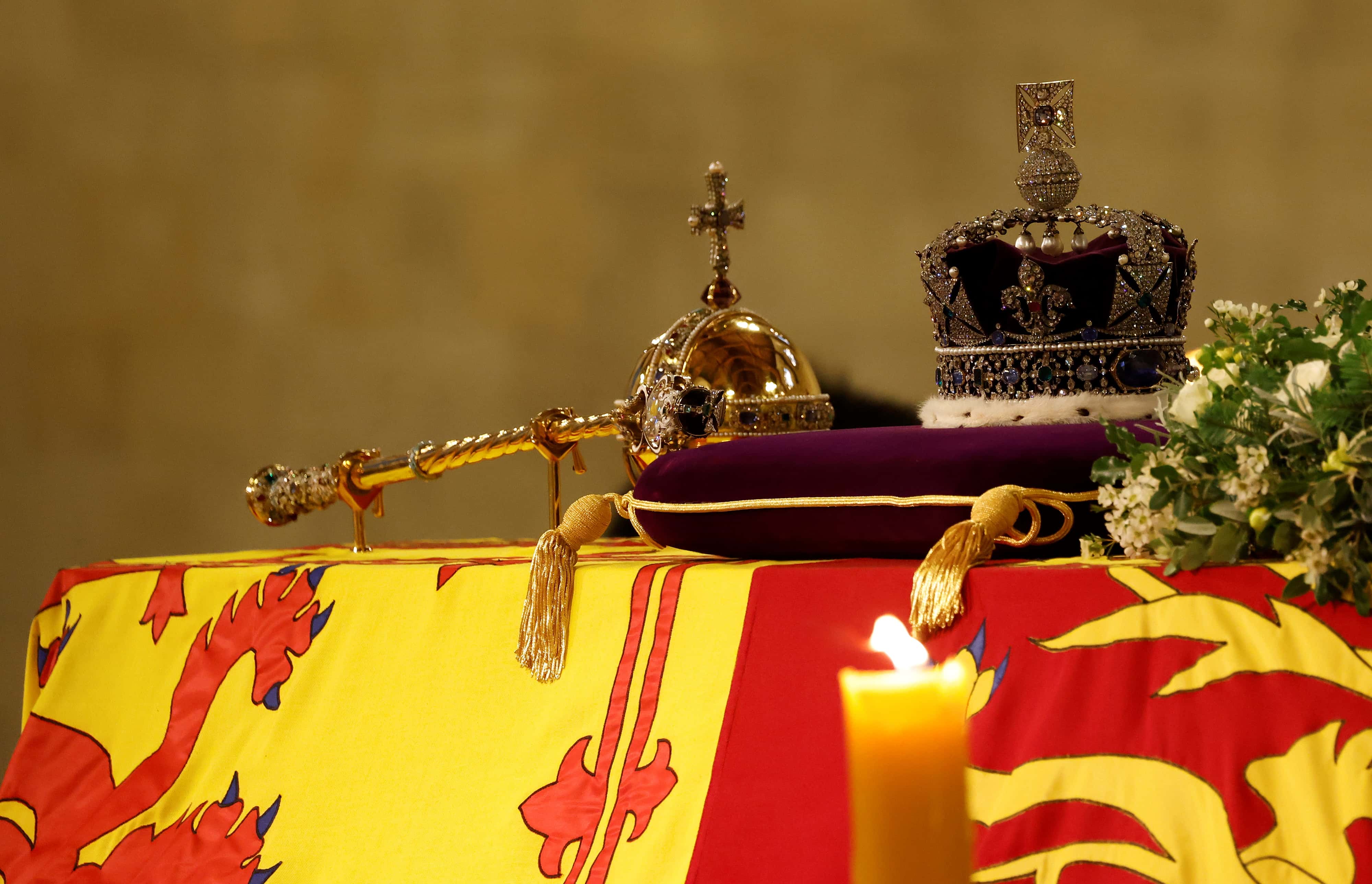 The coffin of Queen Elizabeth II, draped in the Royal Standard with the Imperial State Crown and the Sovereign's orb and sceptre, lying in state on the catafalque in Westminster Hall, at the Palace of Westminster, ahead of her funeral on Monday, on September 15, 2022 in London, England.