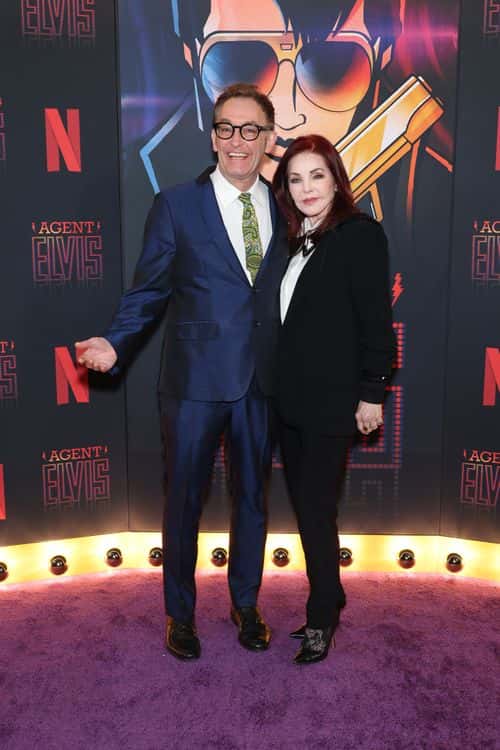 (L-R) Tom Kenny and Priscilla Presley attend the advance screening event photo call for Netflix's