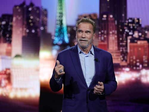 Actor Arnold Schwarzenegger speaks during a keynote address by Chairman of the Board of Management of BMW AG Oliver Zipse at CES 2023 at The Pearl concert theater at Palms Casino Resort on January 04, 2023 in Las Vegas, Nevada. CES, the world's largest annual consumer technology trade show, runs from January 5-8 and features about 3,100 exhibitors showing off their latest products and services to more than 100,000 attendees.